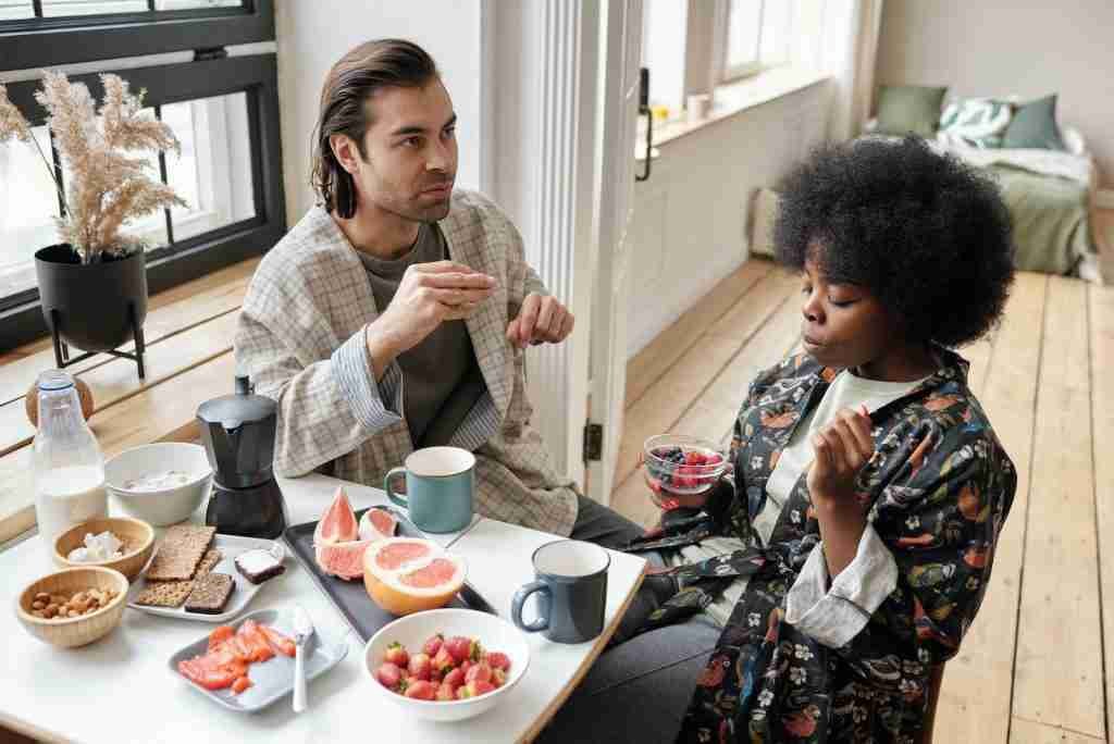 Couple Having Breakfast at Home with Ritz crackers
