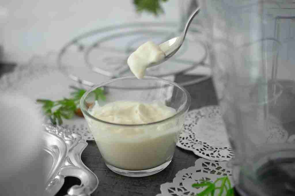 close-up photo of yogurt in clear shot glass