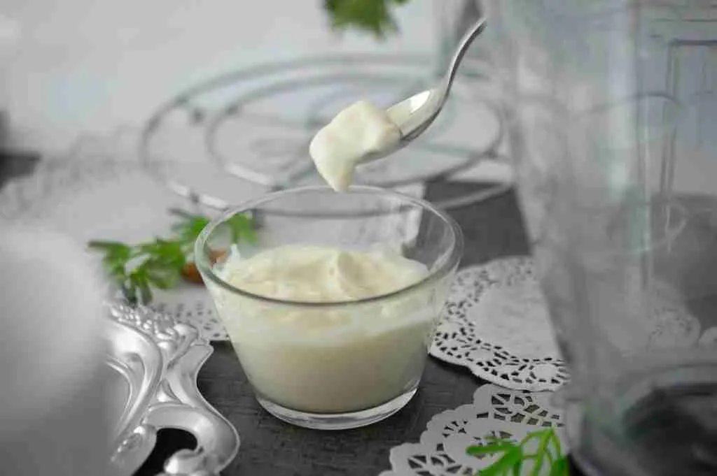 close-up photo of Yogurt in clear shot glass