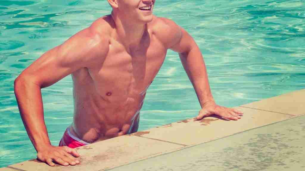 man coming out of pool