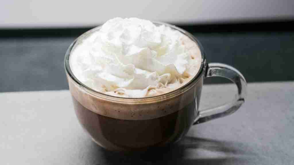 white cream in clear glass mug