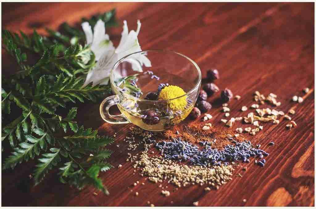 clear herbal tea cup on brown surface