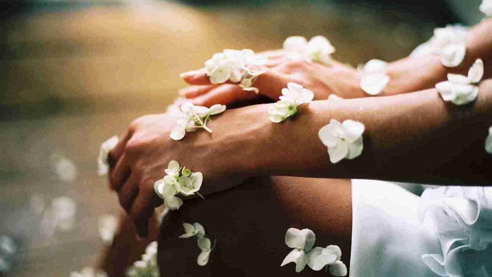 person surrounded by white flowers
