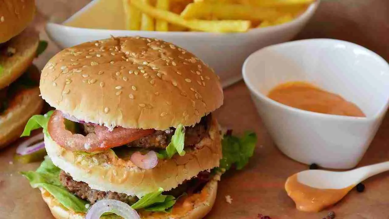 Beef Burger along with fries and sauce.
