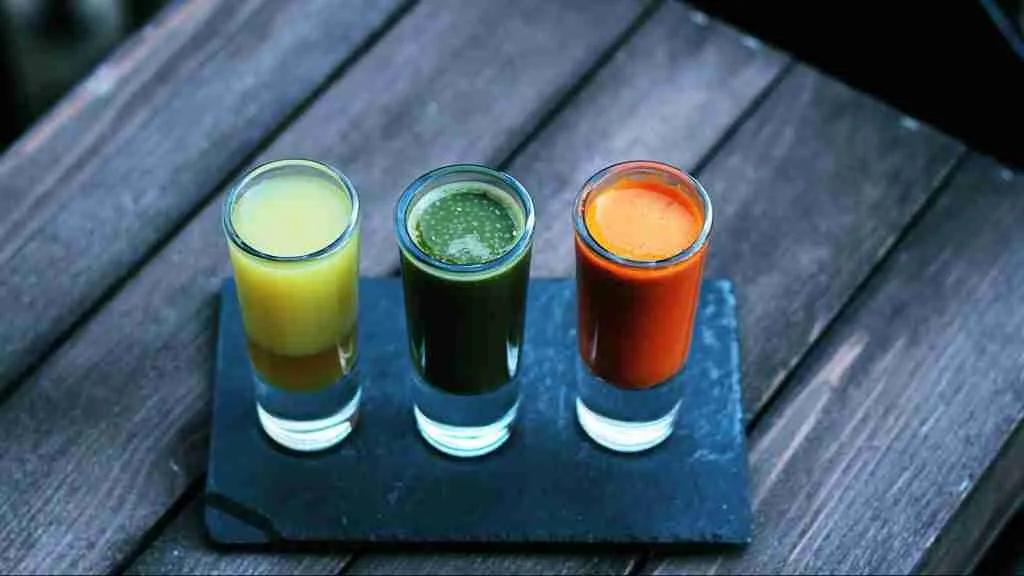 three clear shot glasses