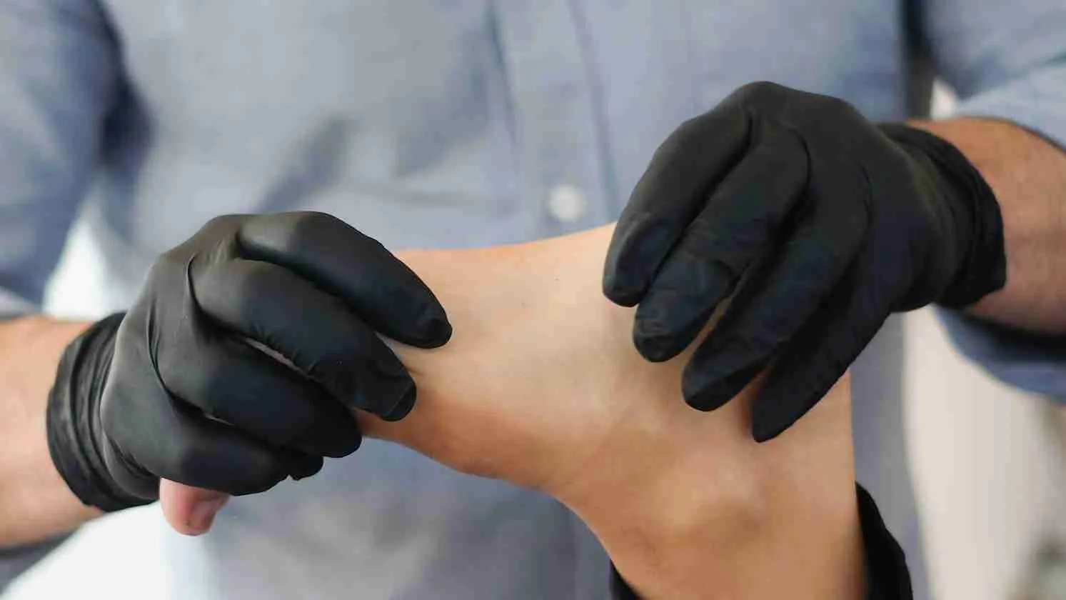 person massaging other person's foot