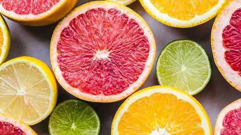 flat lay photography of sliced lime and lemon which are source of Vitamin C serum