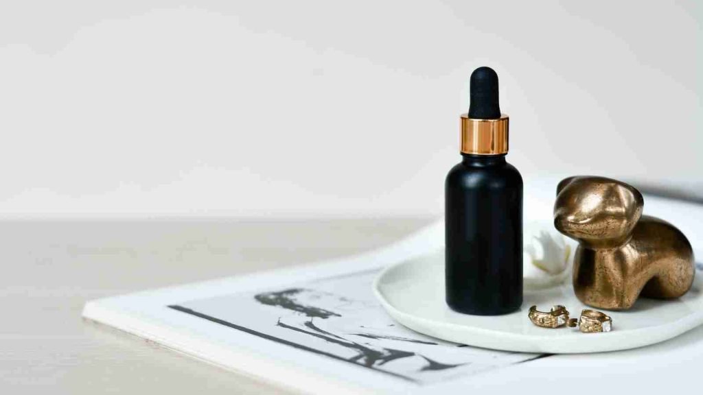 bottle of skin serum on a plate