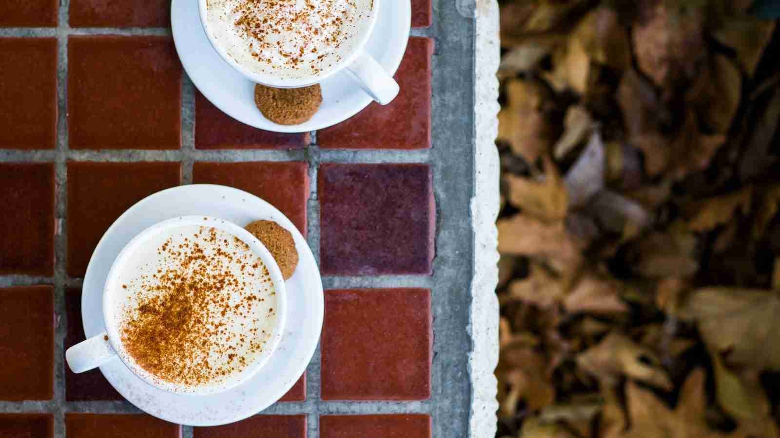 two cup of chai latte on table top