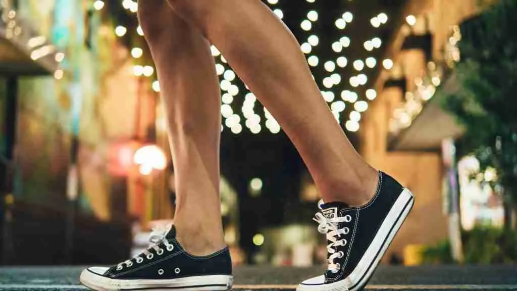 person wearing black-and-white low-top sneakers