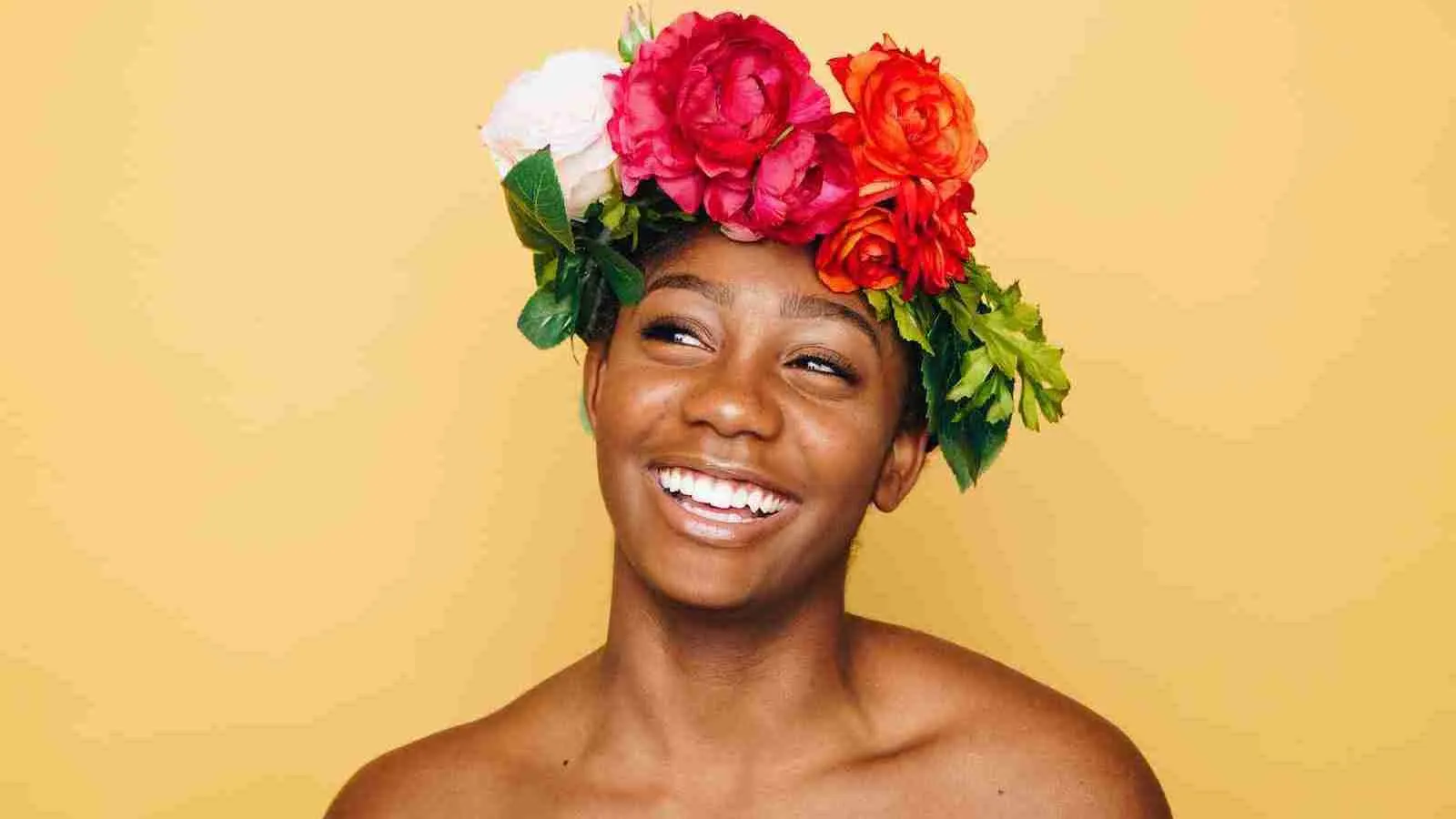 woman smiling wearing flower crown