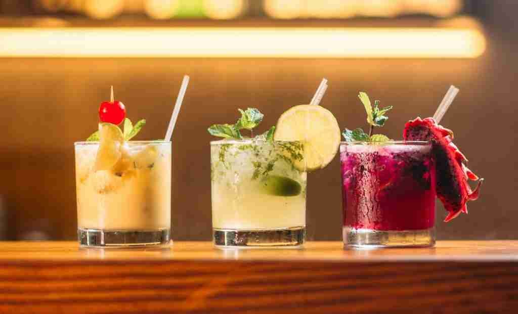 three clear glass cups with juice