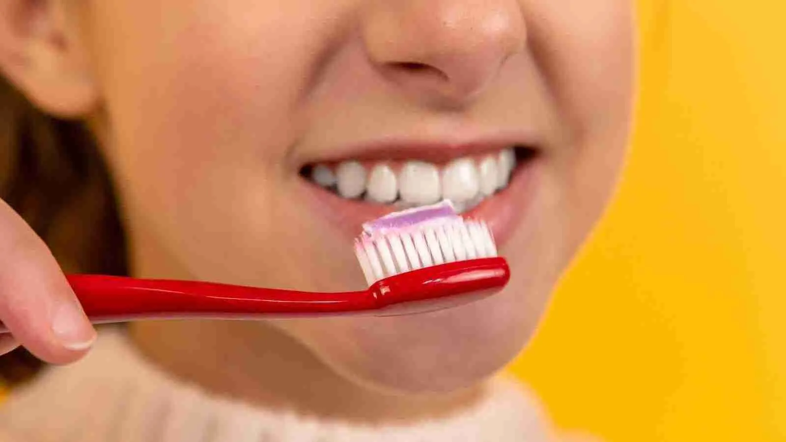 girl brushing her teeth 