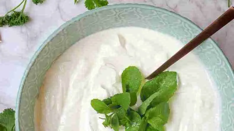 a bowl of yogurt with a spoon in it