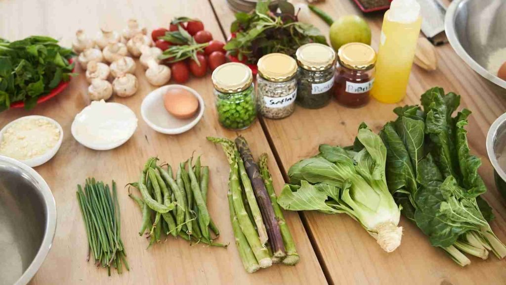 green vegetable on brown wooden table