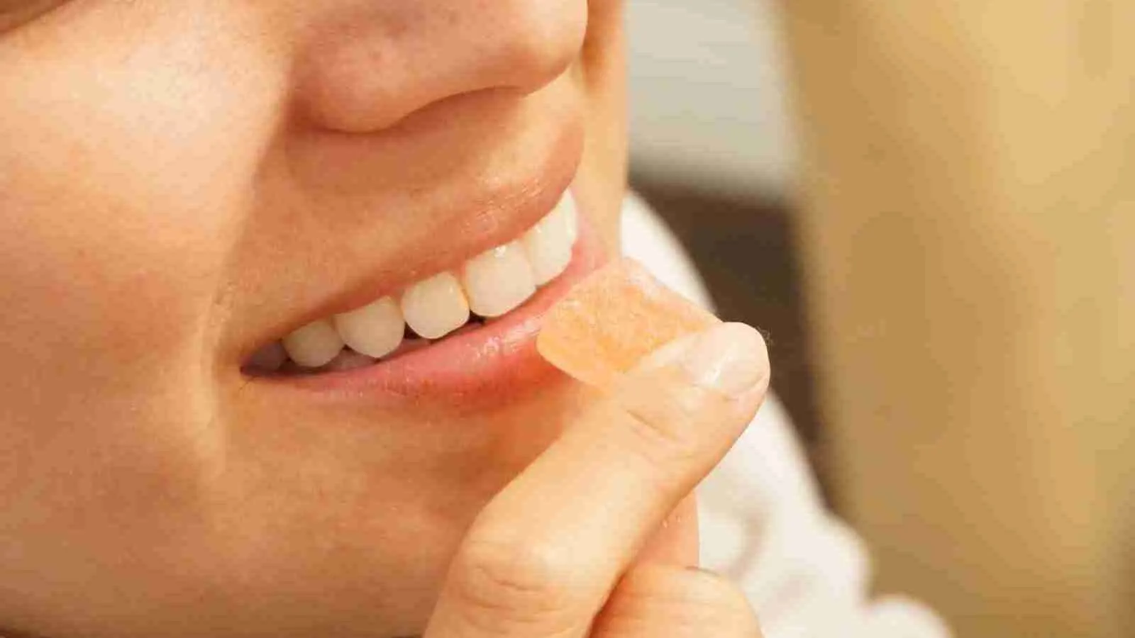 woman holding gummies