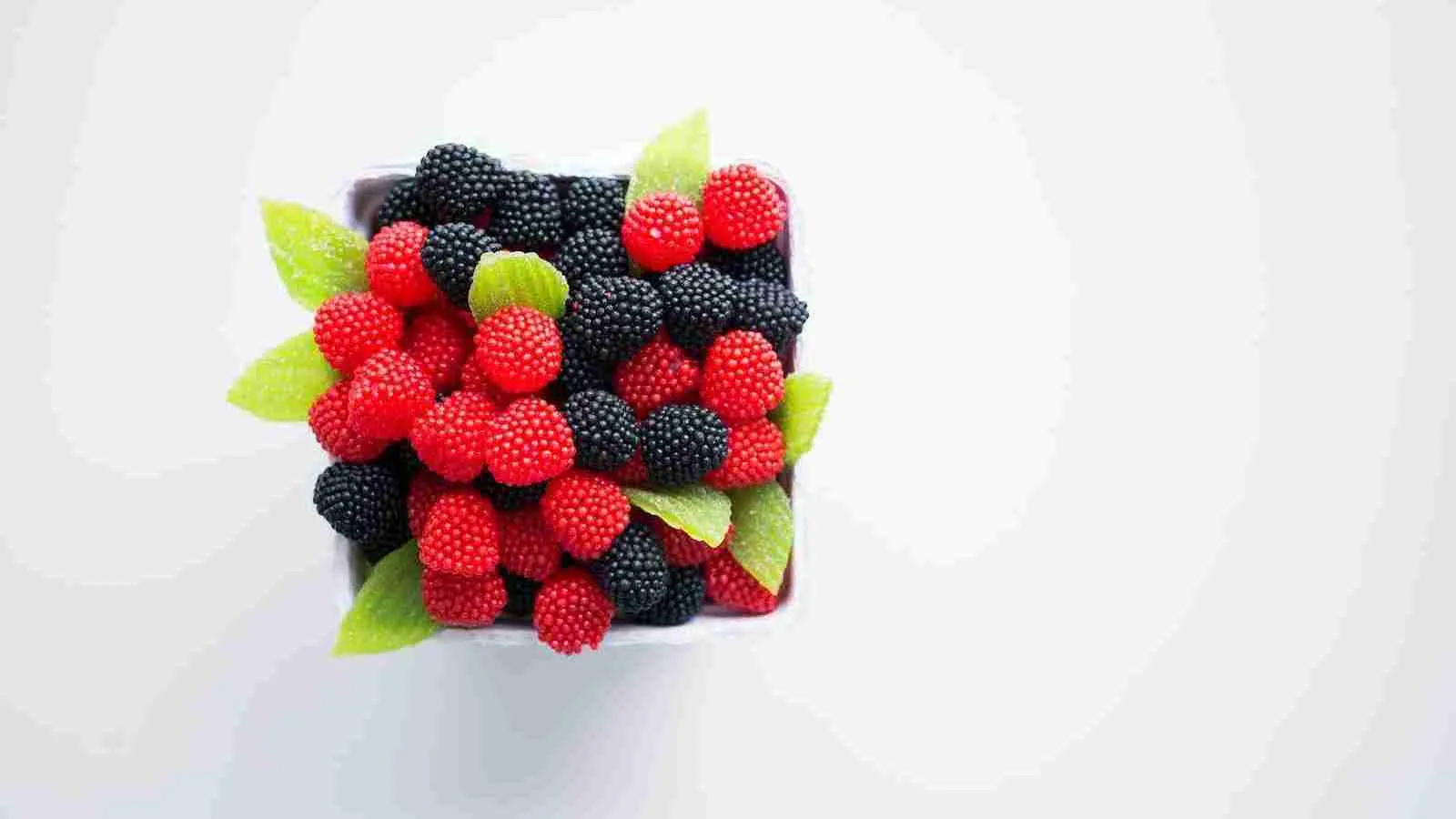 bowl of red and black berries