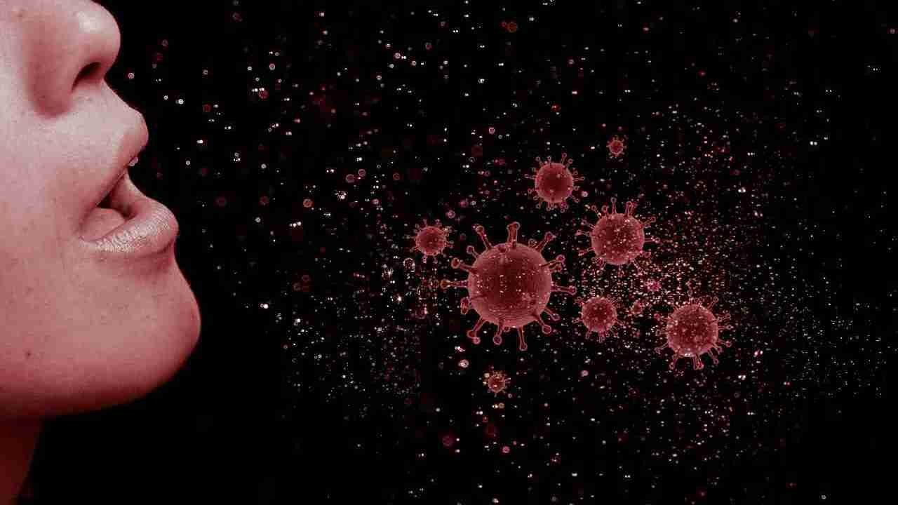 a woman coughs showing spread of virus
