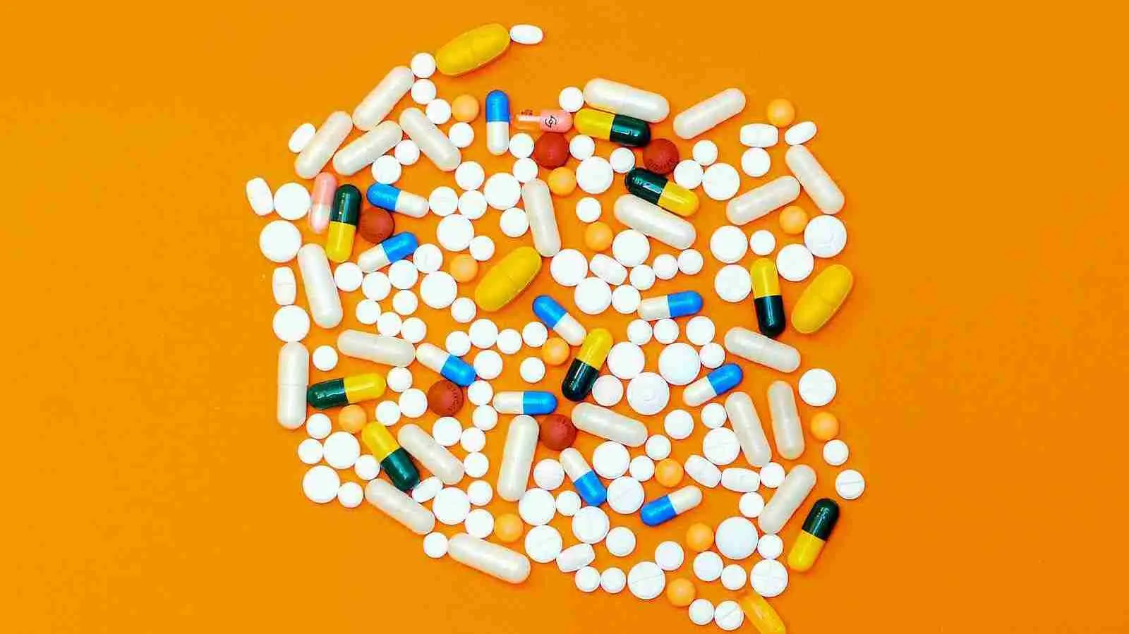 white and orange medication pill