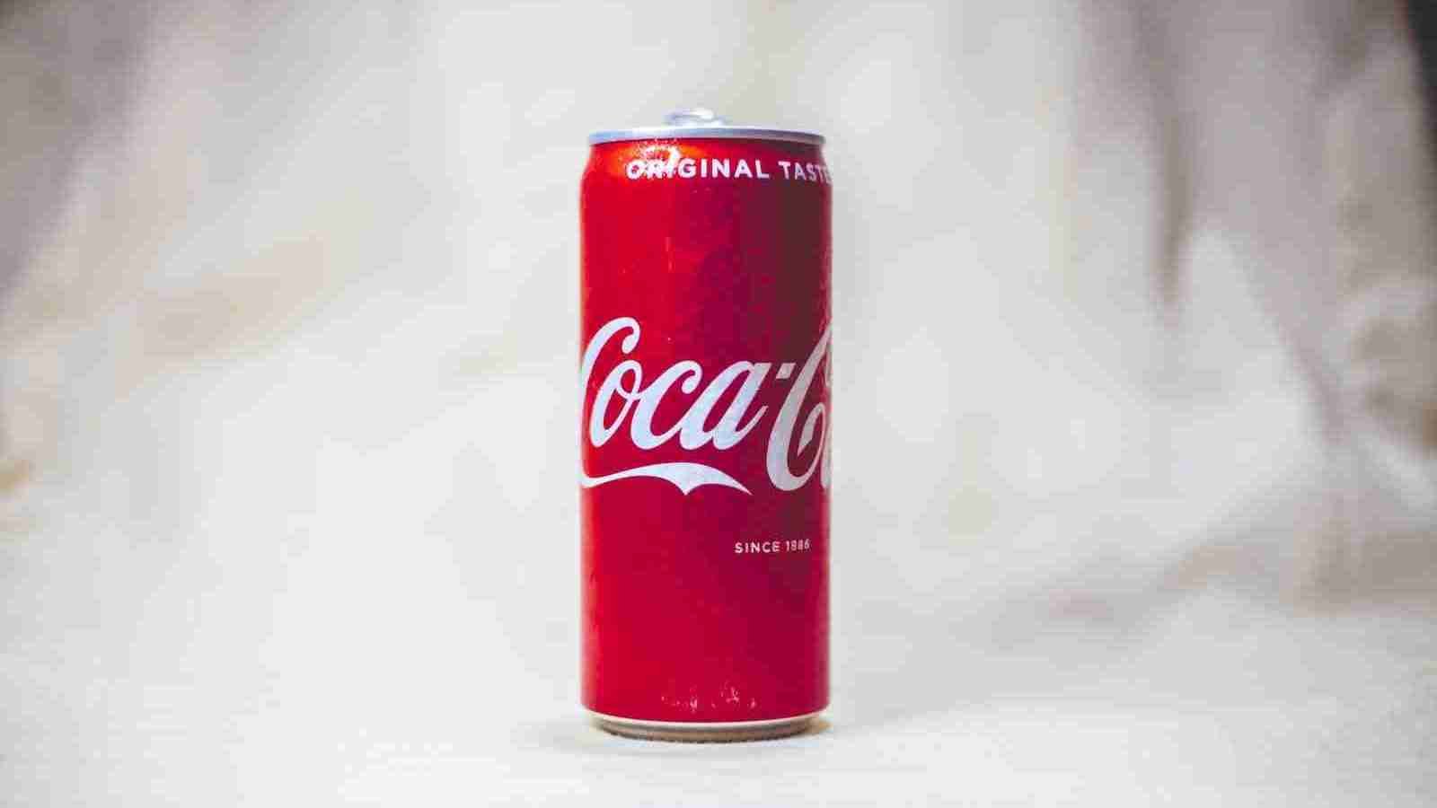 coca cola can on white table