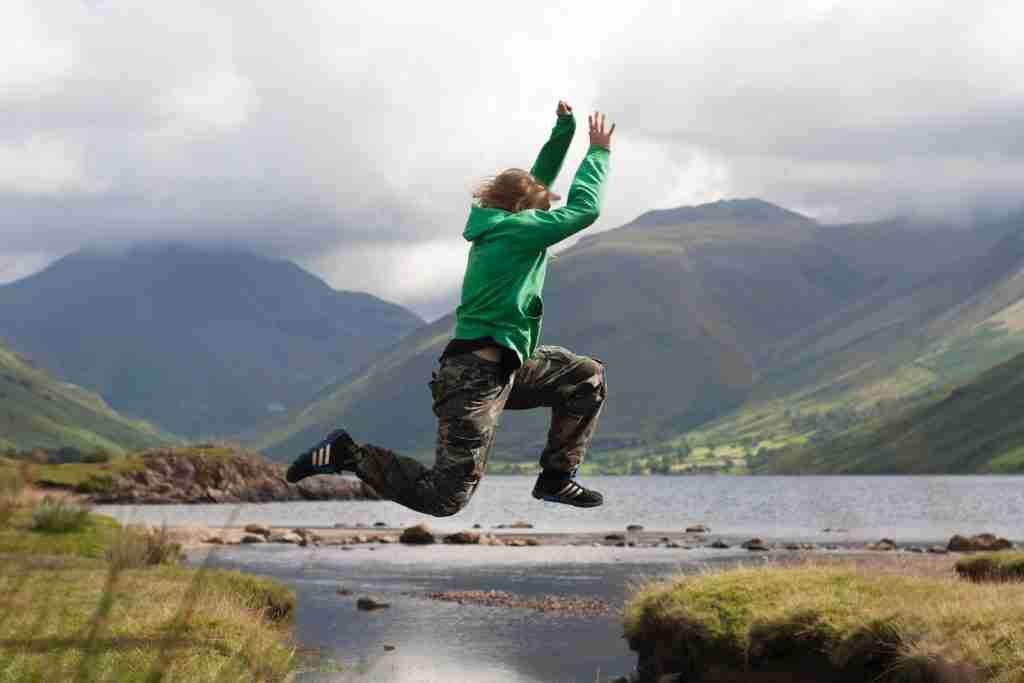 person jumping cliff