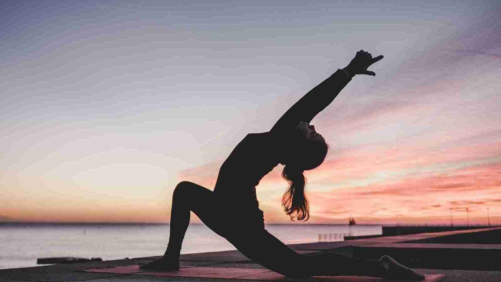 silhouette photography of woman doing yoga