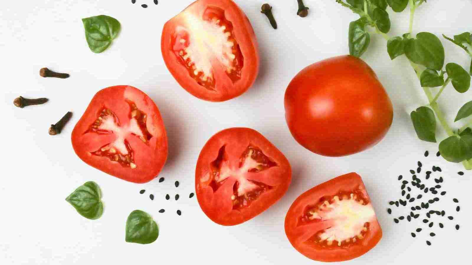 red tomato on white surface