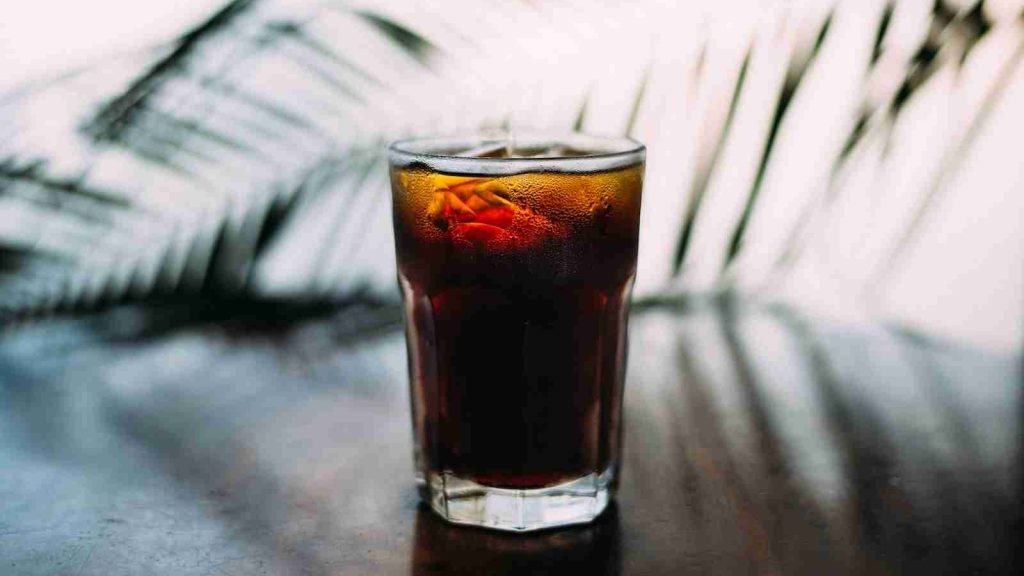 selective focus photo of glass of sweat tea