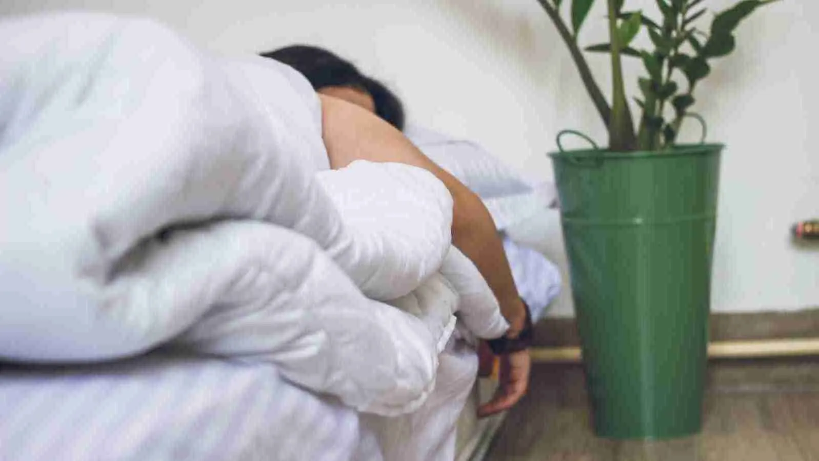 a person sleeping in his bed.