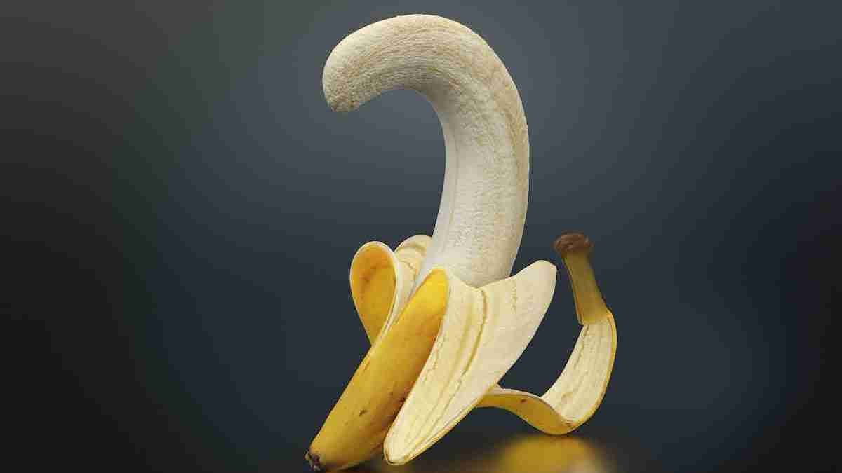 a peeled banana sitting on top of a table