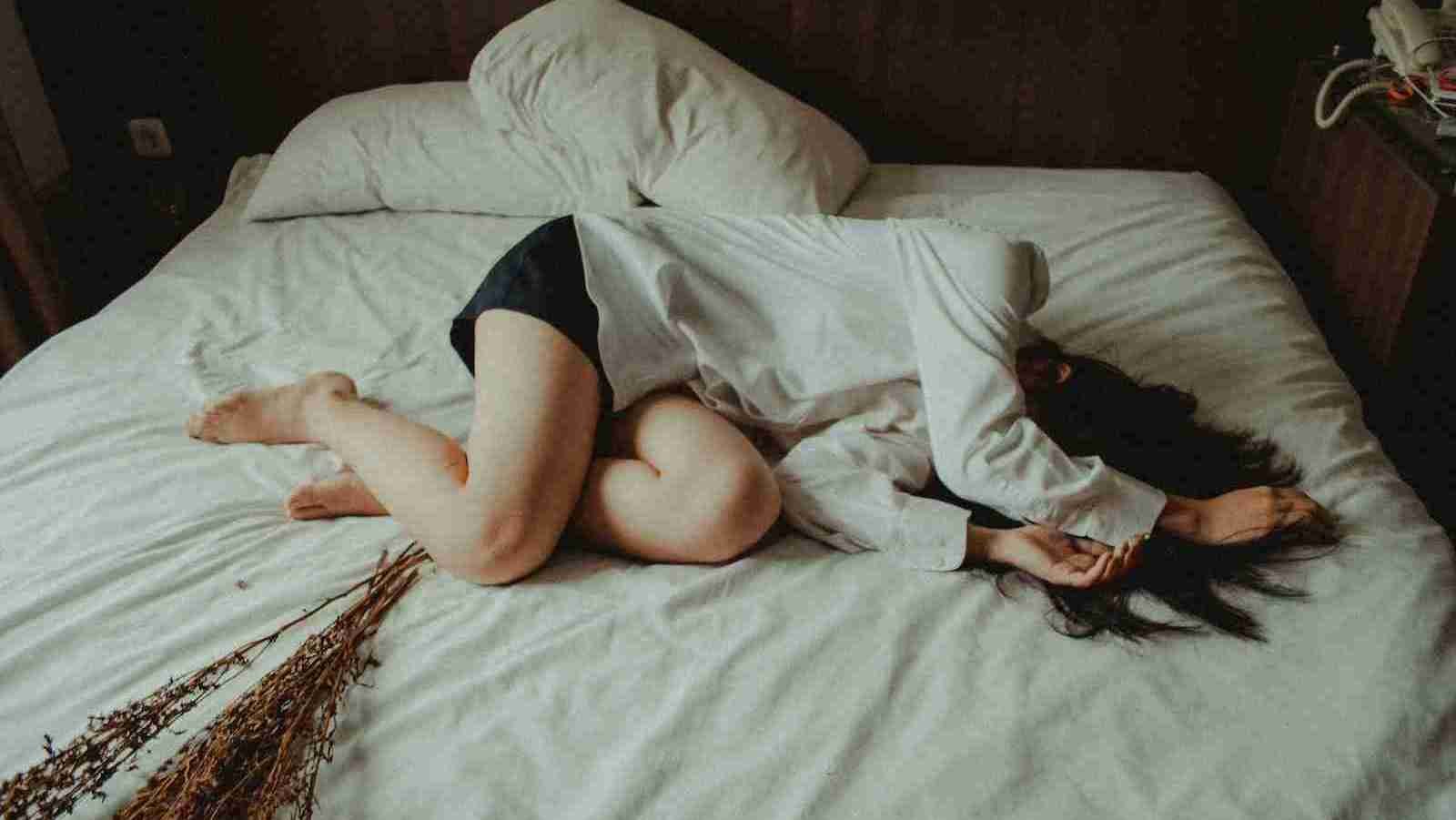 woman lying on bed